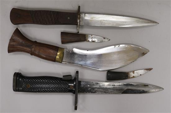 A WWI German knife, a WWII US Army knife and a kukri